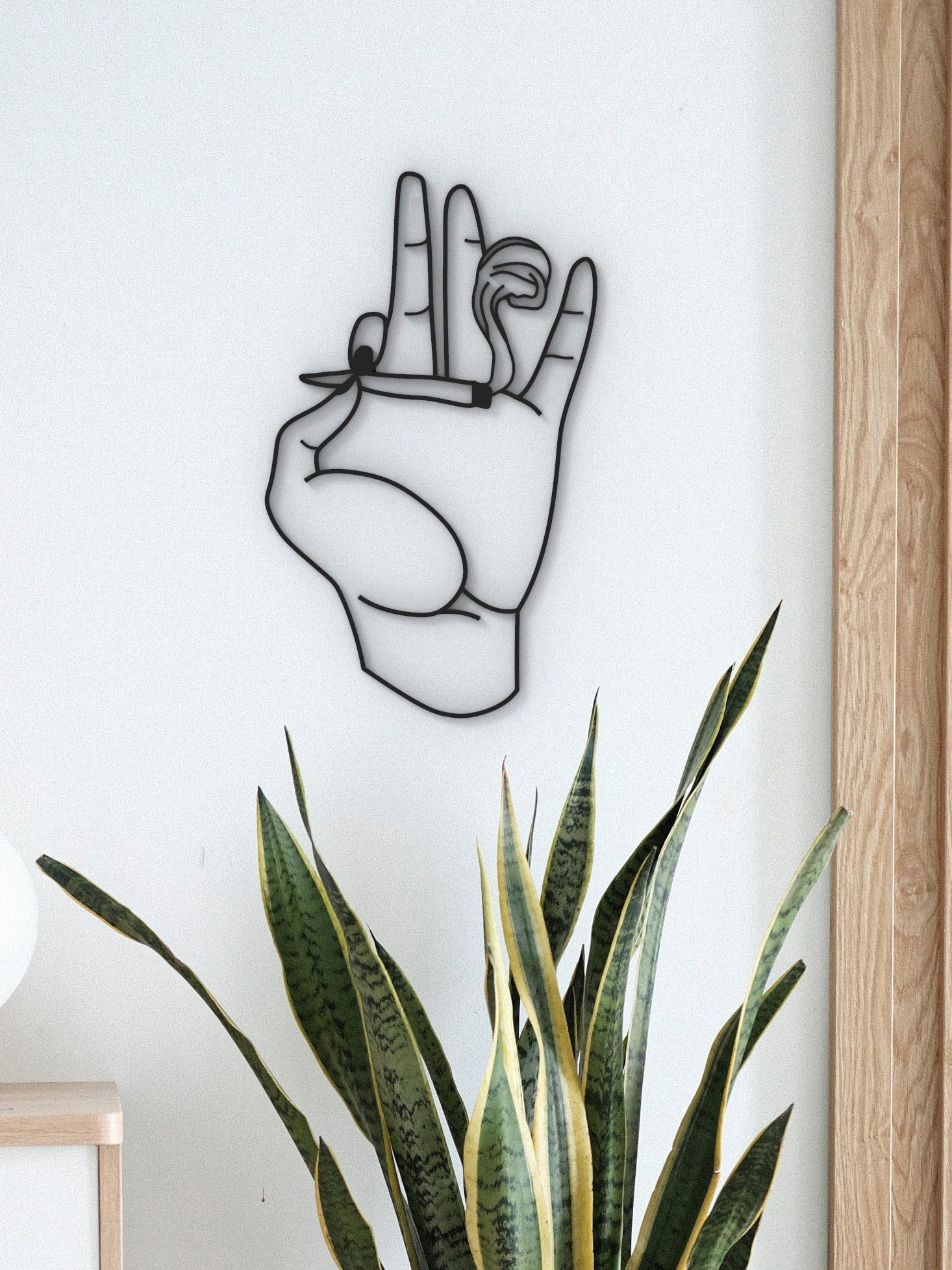 Hero image of the sculptural hand wall art